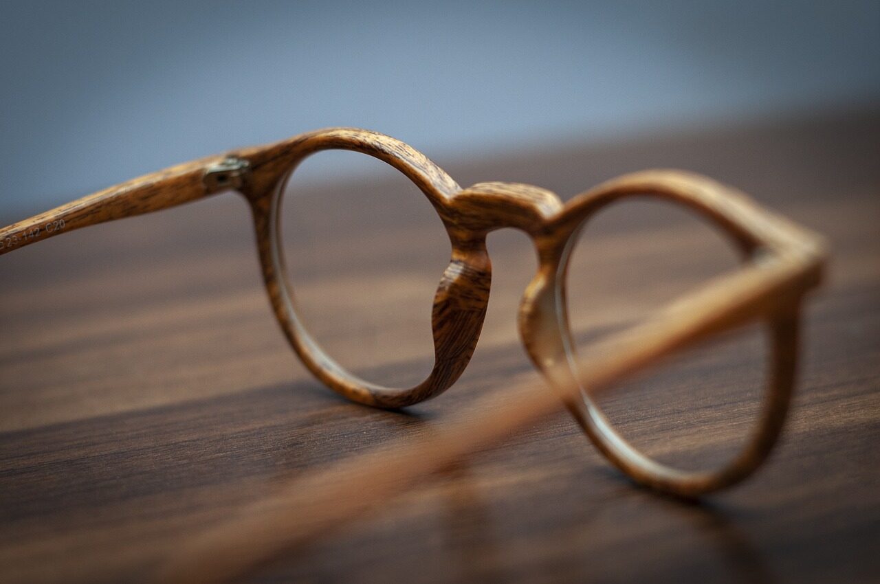 A pair of spectacle frames resting on a table